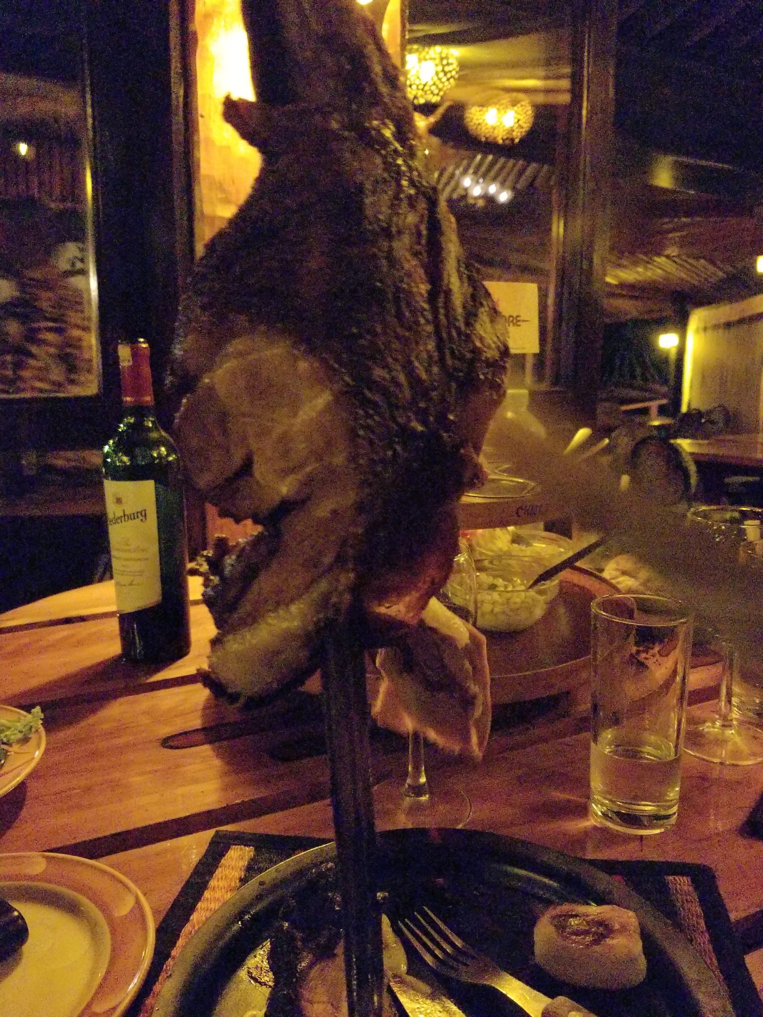a meat on a skewer on a table