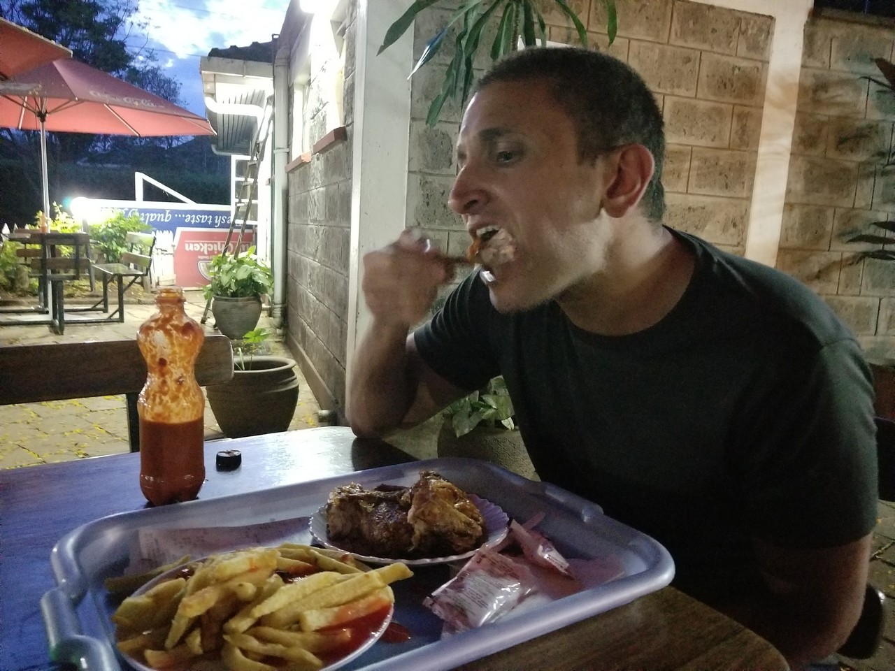 a man eating food at a table