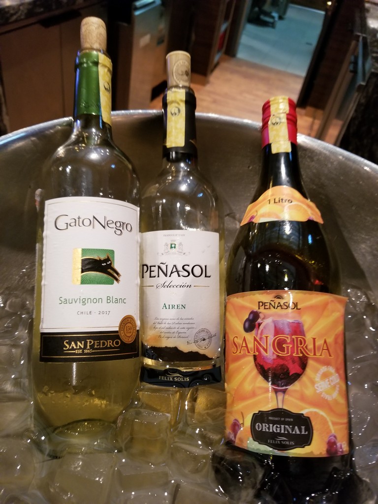 a group of bottles of wine in a bucket
