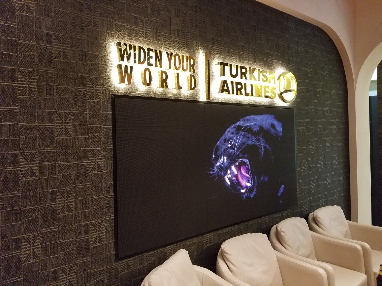 a large screen with a panther on it