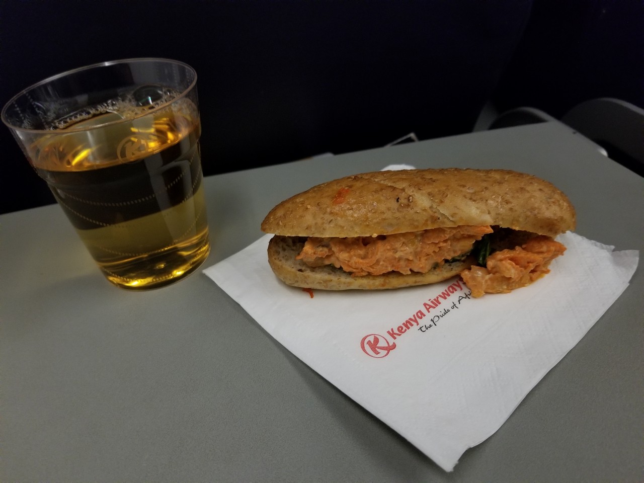 a sandwich and a glass of beer