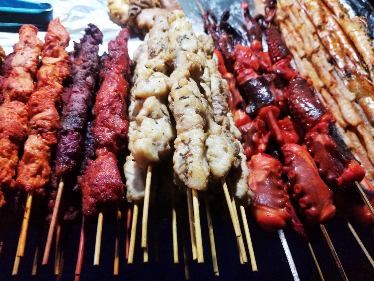 a group of skewers of meat