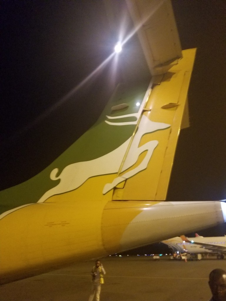 a tail fin of an airplane at night