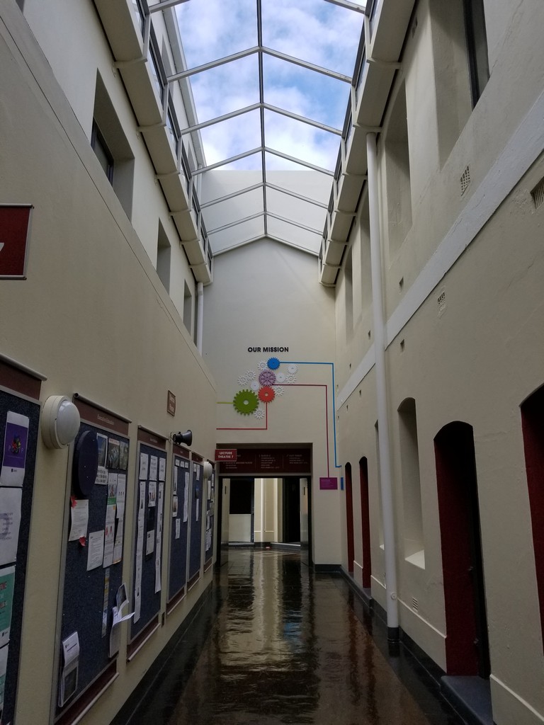 a hallway with a glass roof