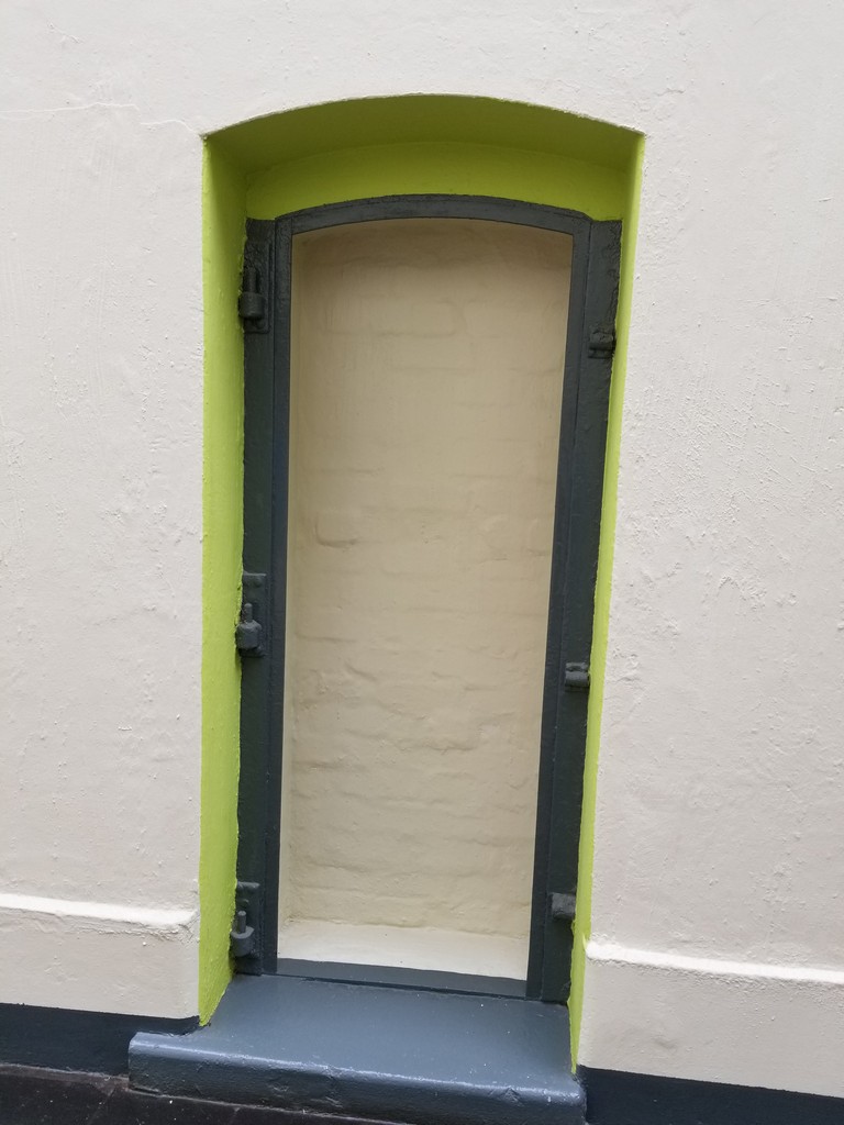 a door in a white wall