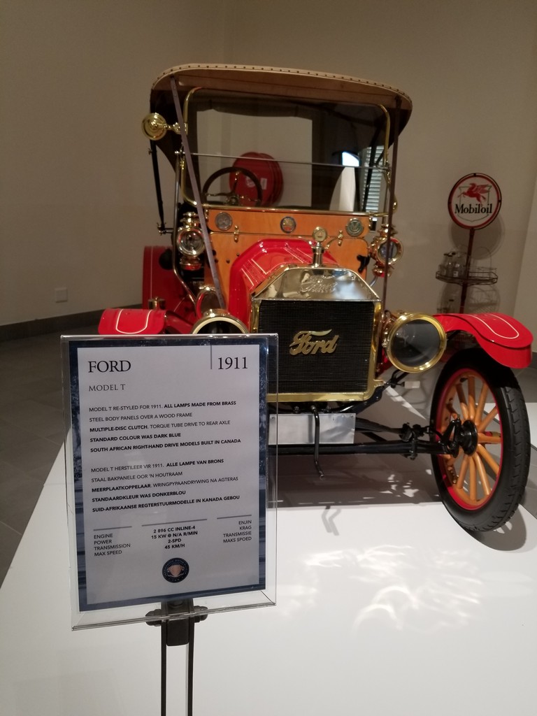 a red and gold car on display