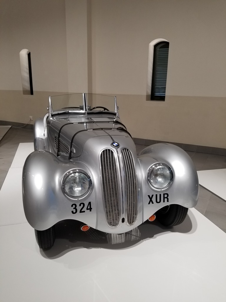 a silver car on a white surface