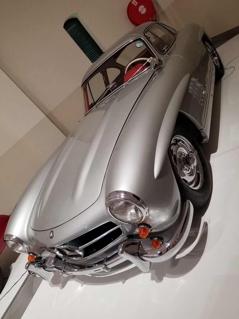 a silver car on a white floor