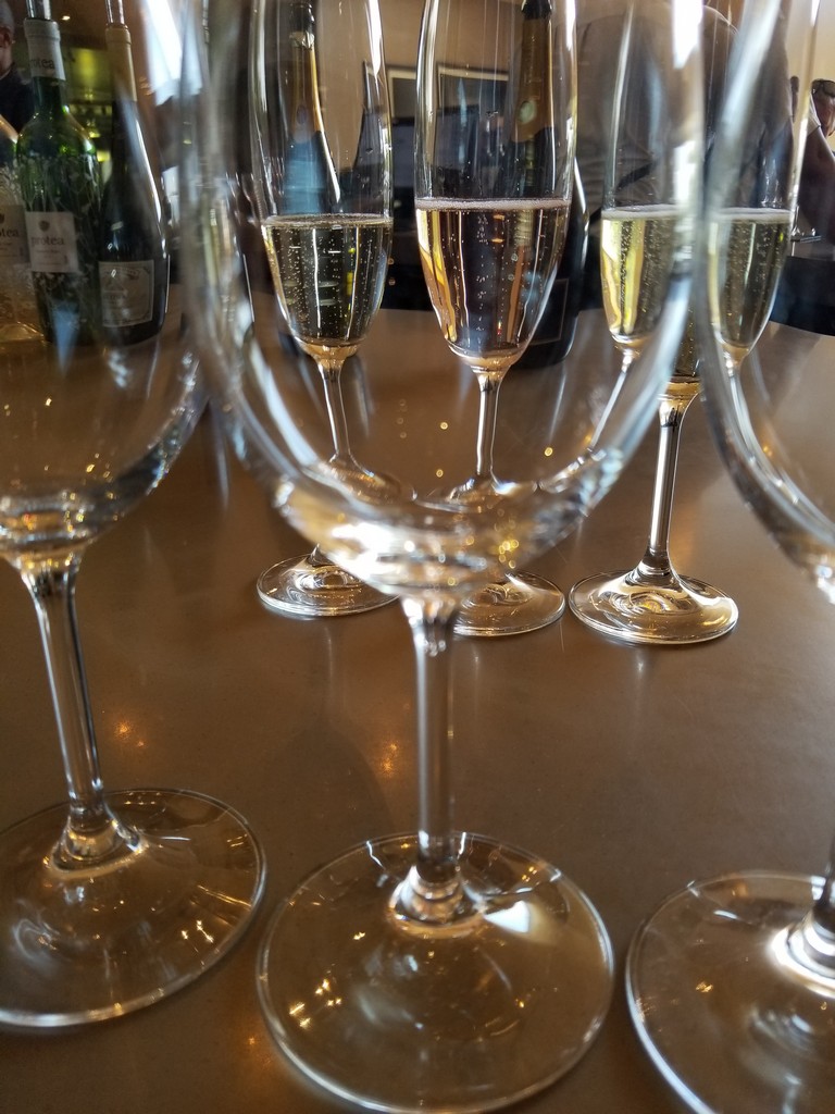 a group of wine glasses on a table