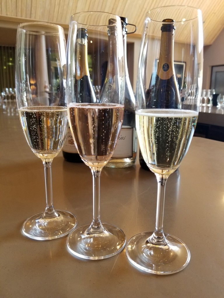 a group of glasses of champagne
