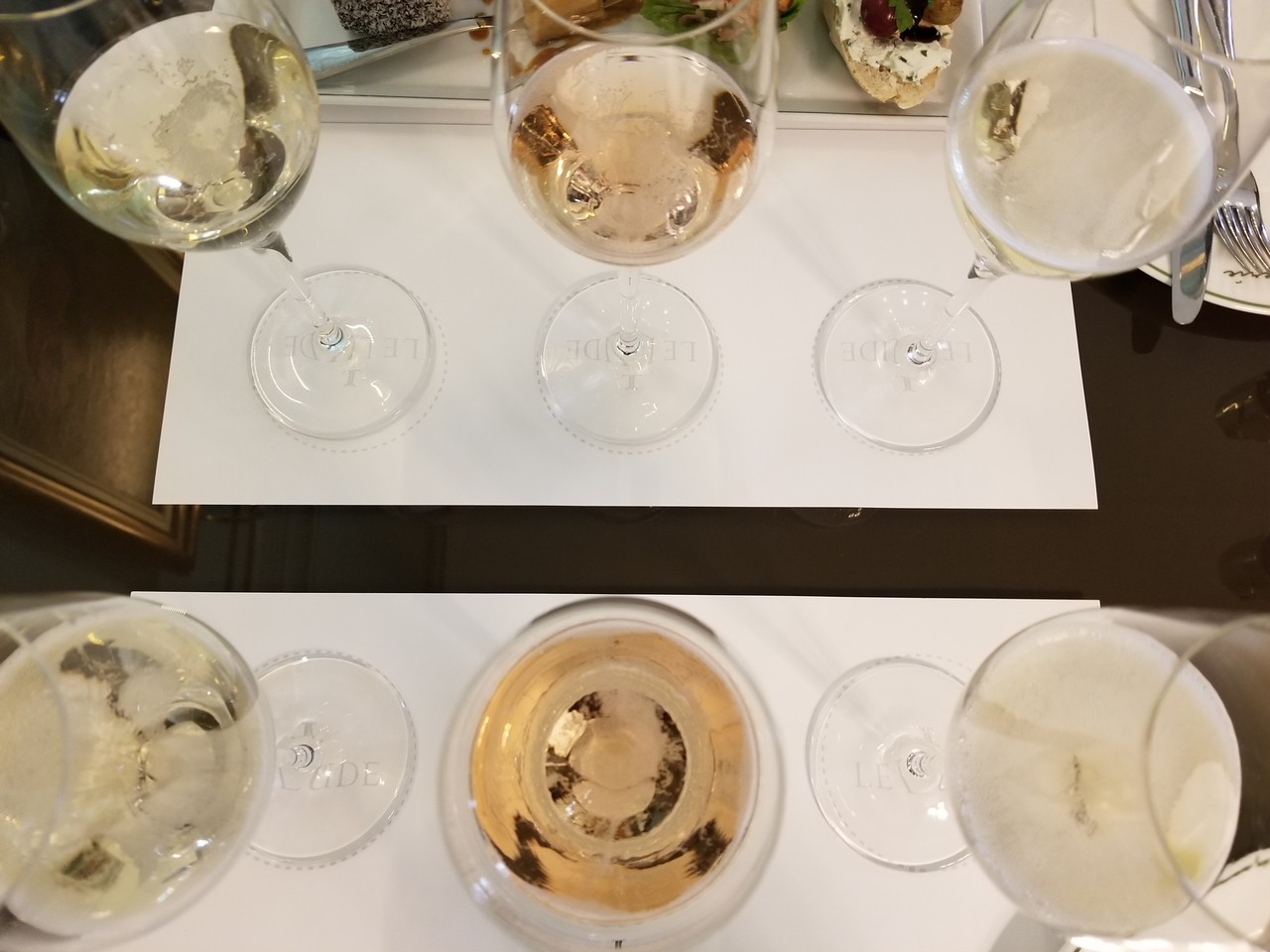 a group of wine glasses on a table