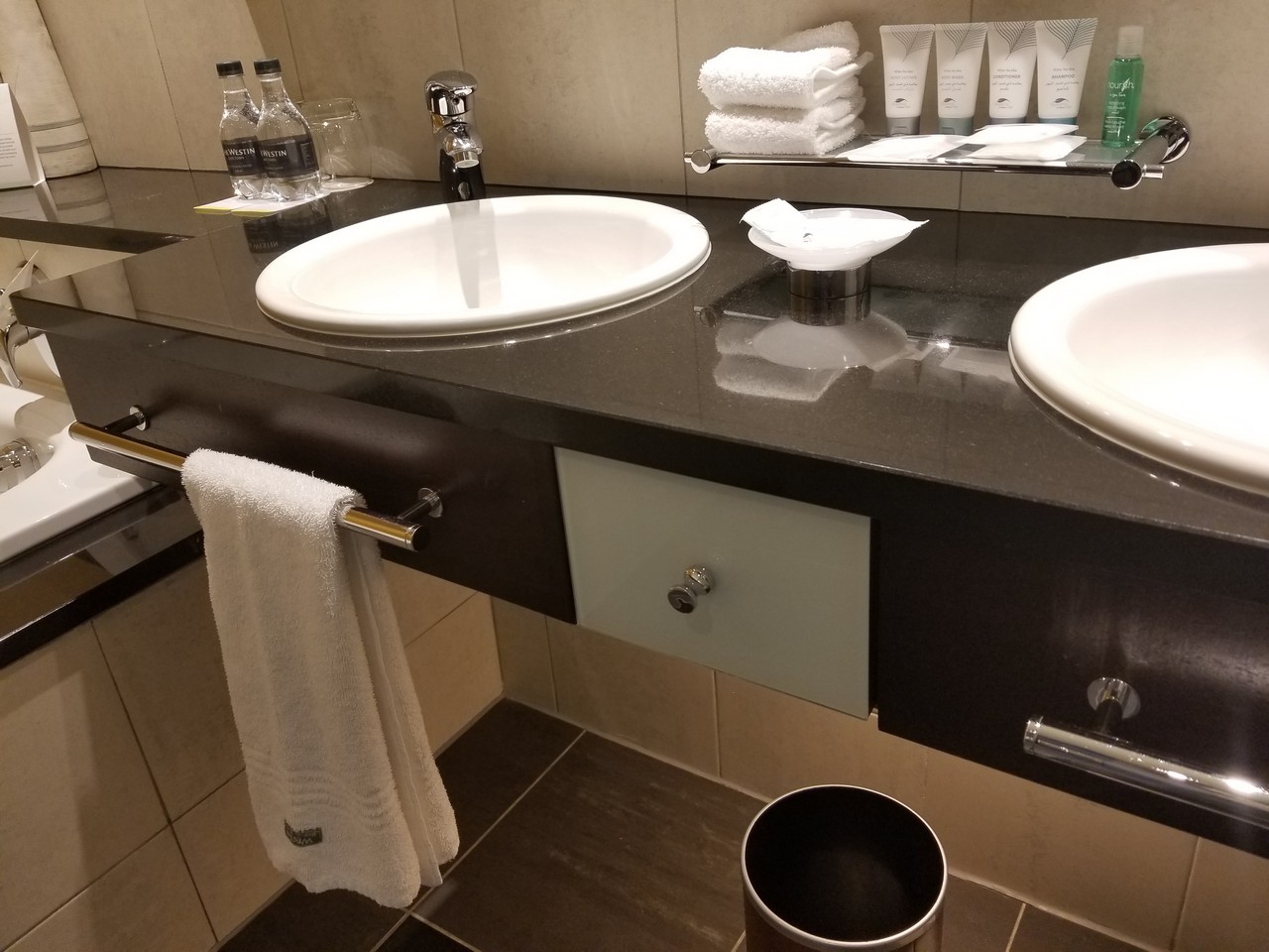 a bathroom with a sink and towels