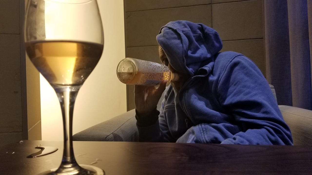 a person drinking from a bottle