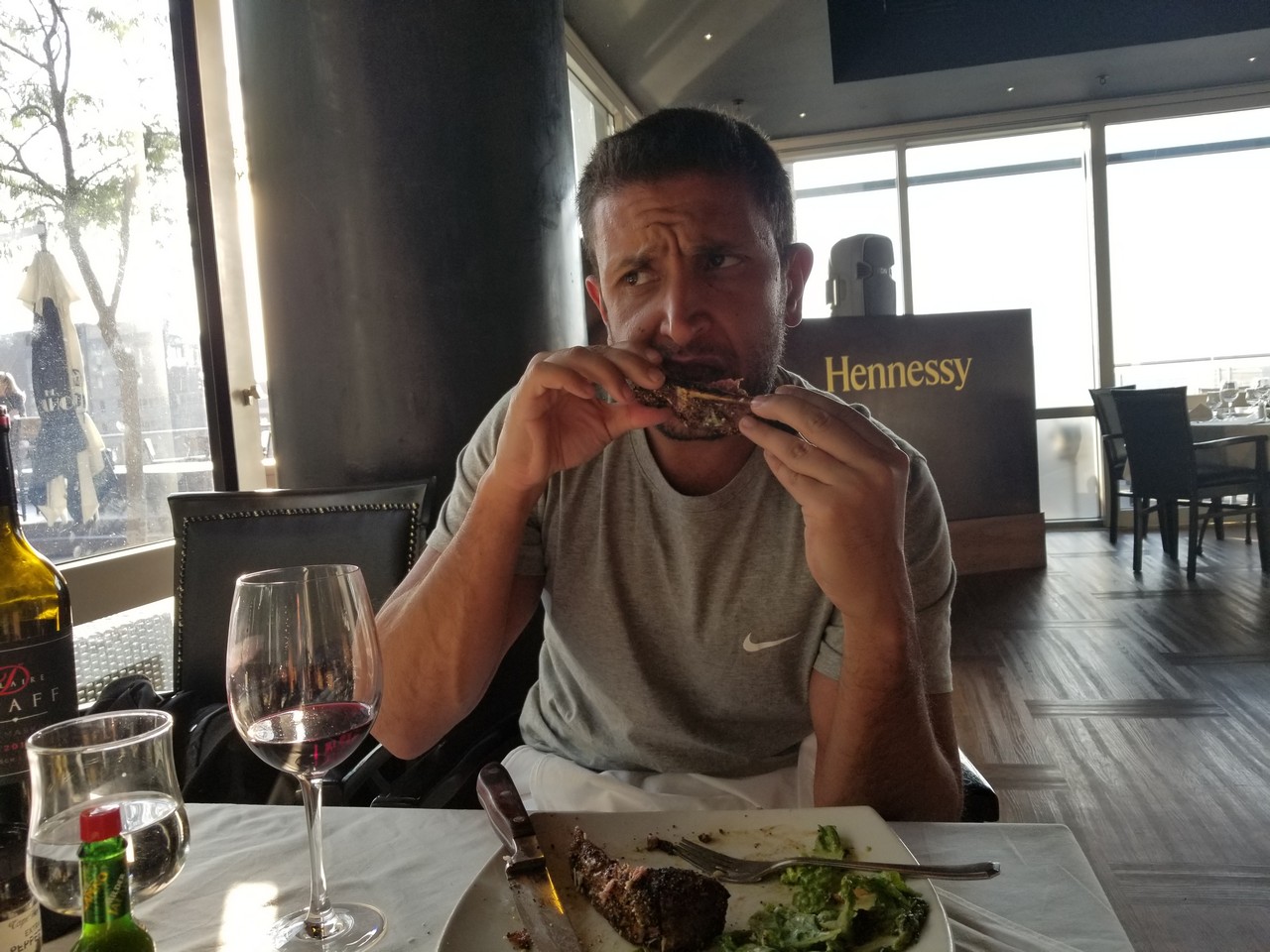 a man eating food at a restaurant