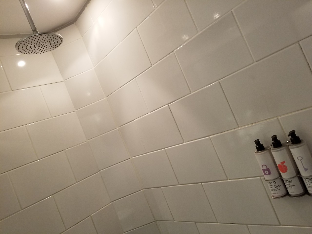 a shower head with a shower head and a spray can