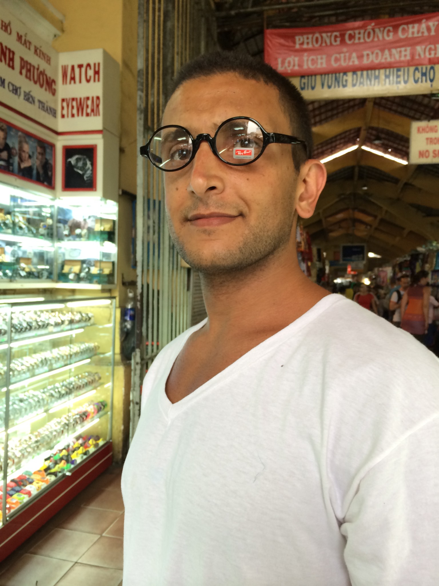 a man wearing glasses in a store