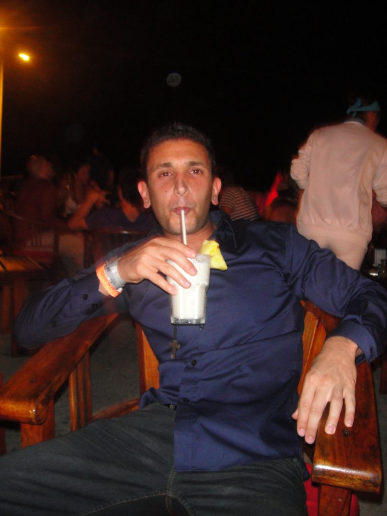 a man drinking from a straw