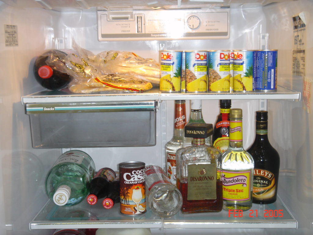 a refrigerator full of alcohol and cans