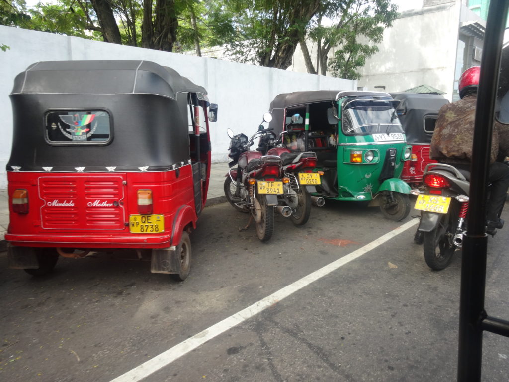 a group of motorcycles and a motorcycle parked on a street