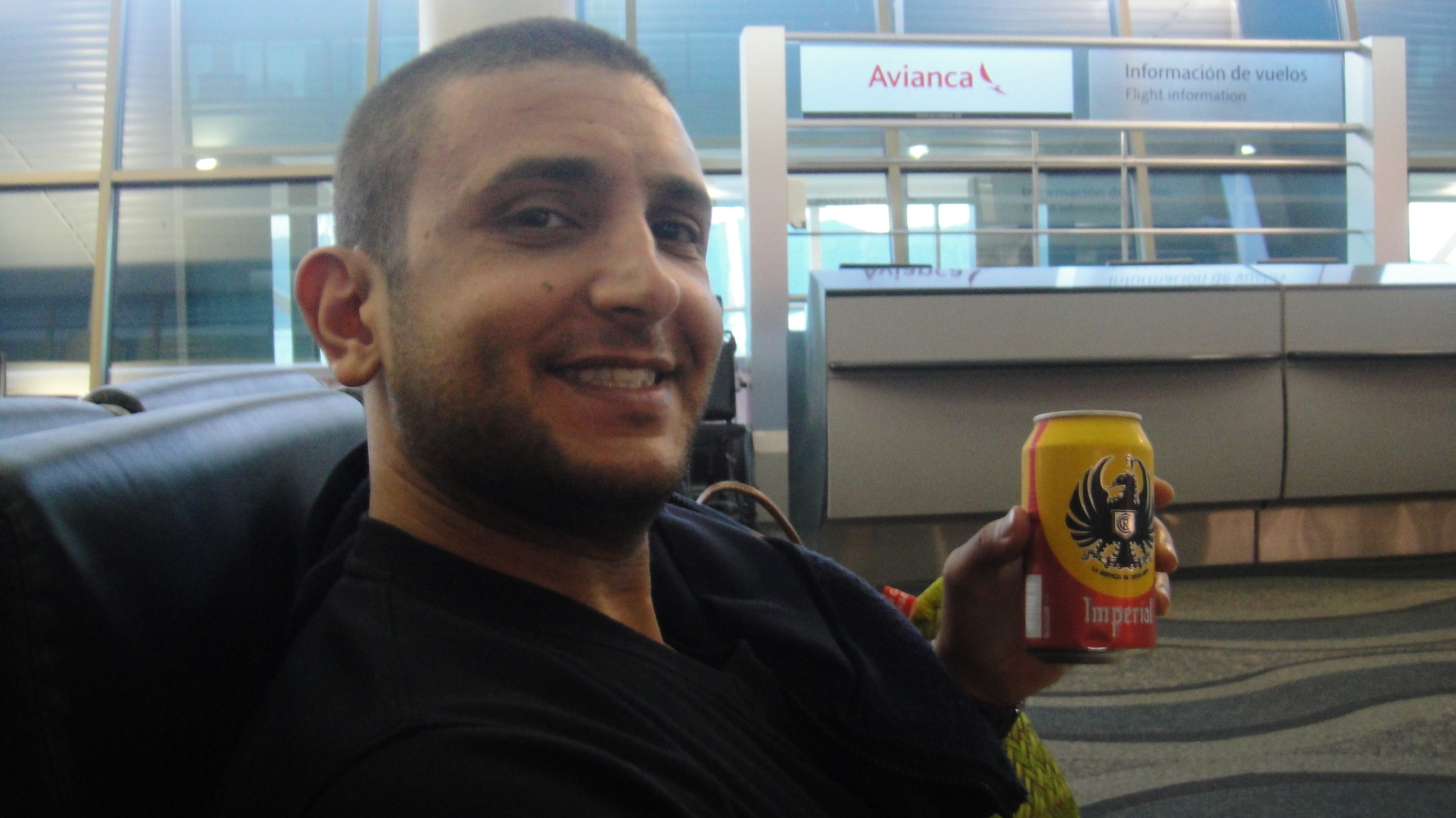 a man holding a can