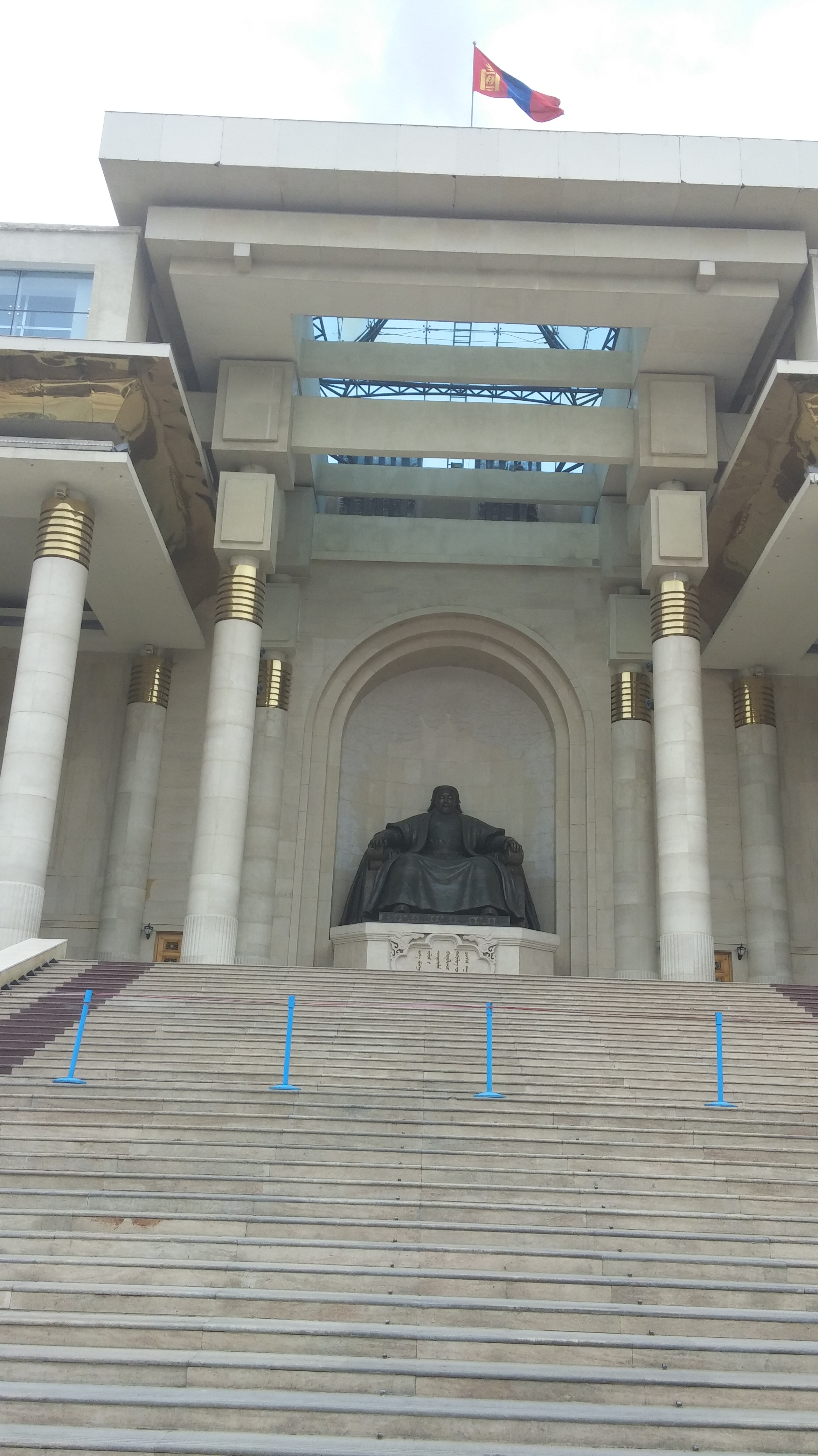 a statue of a man in a large building