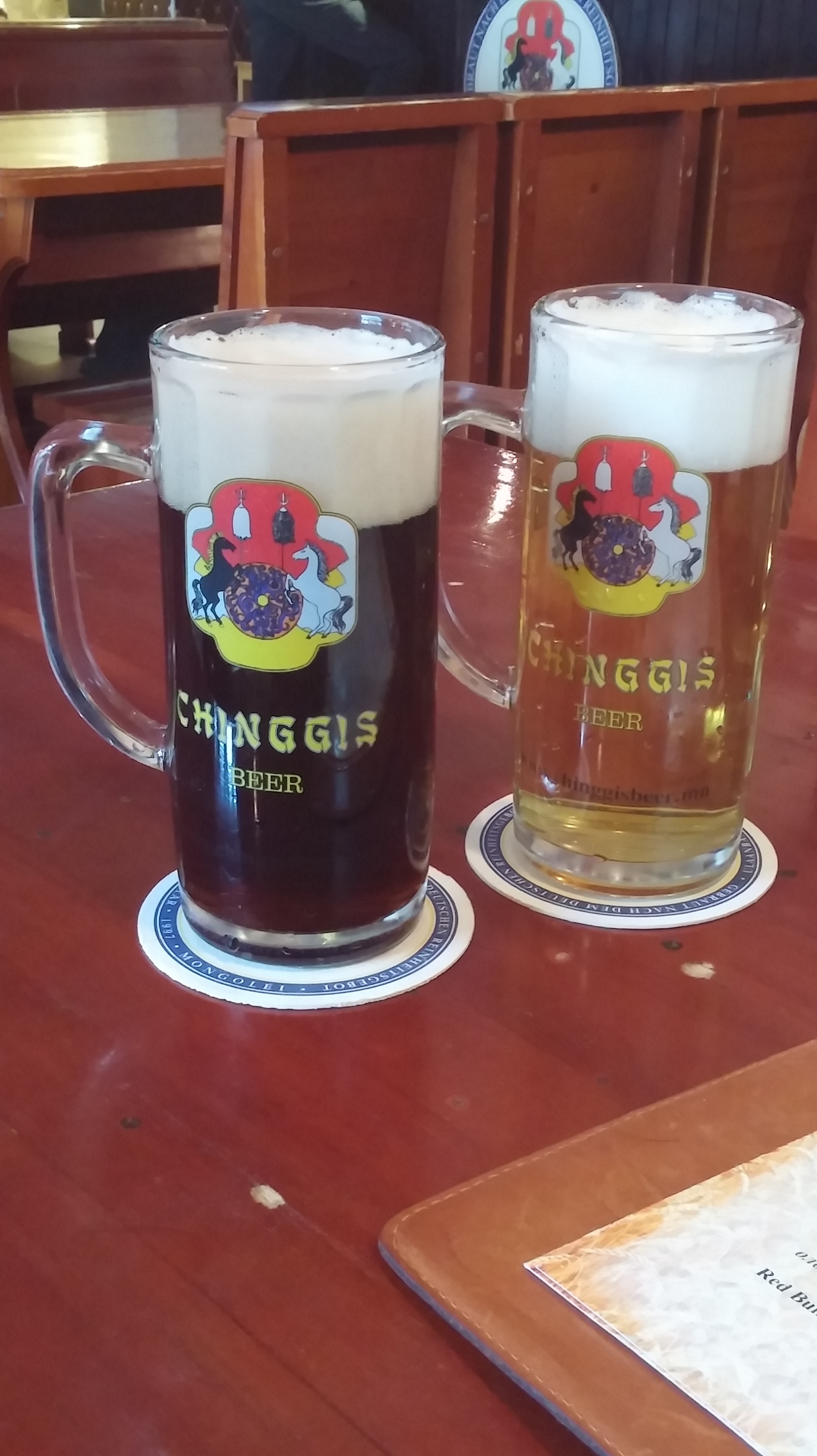 two glasses of beer on a table