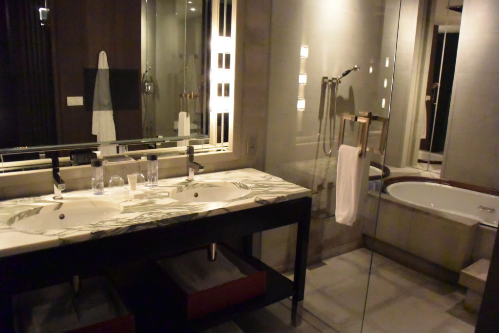 a bathroom with a large mirror and sink