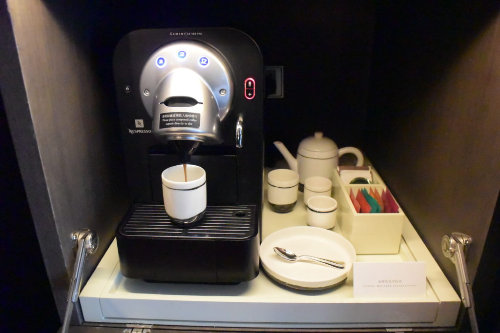 a coffee machine with a cup of coffee