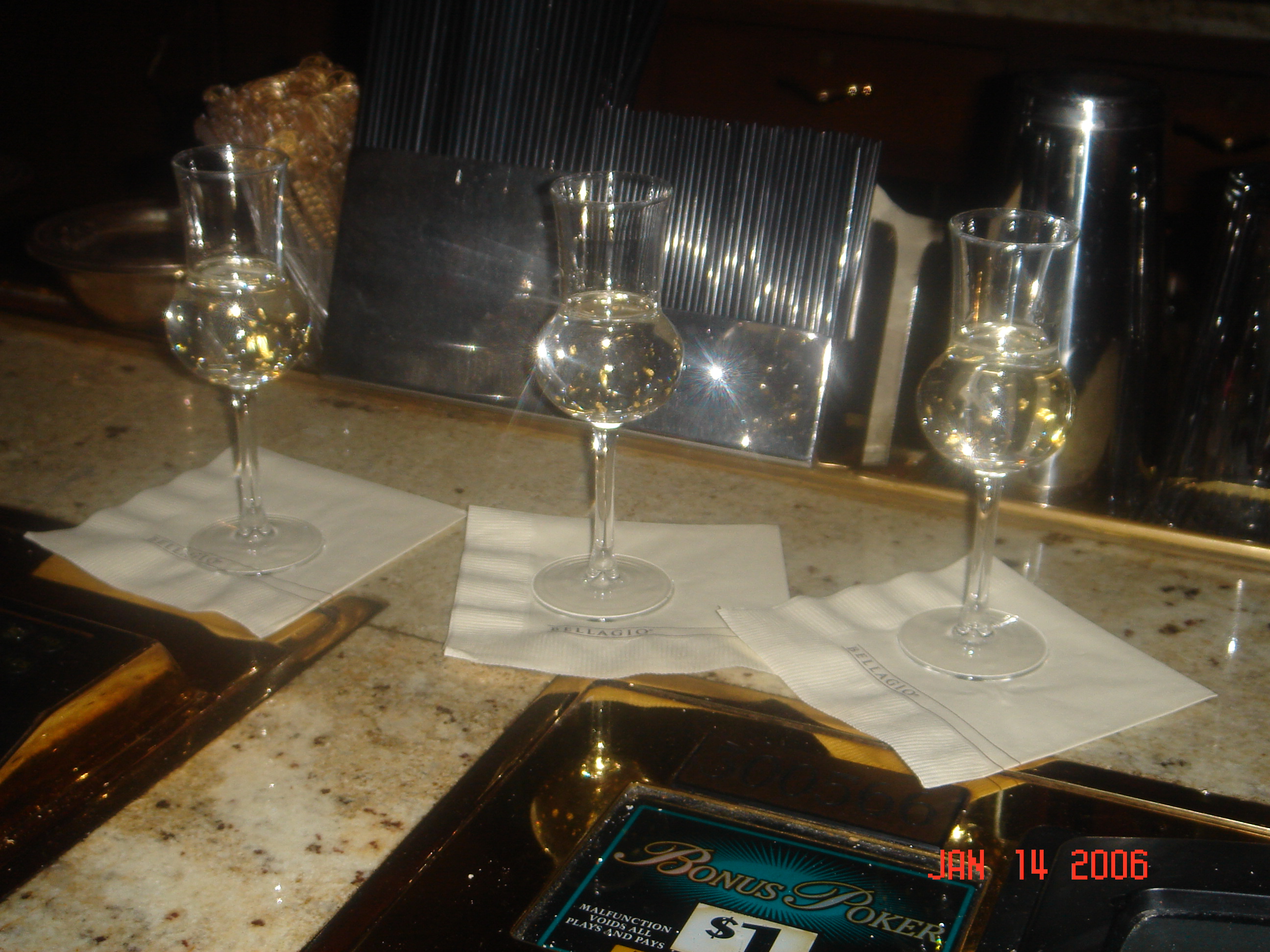 a group of wine glasses on a counter
