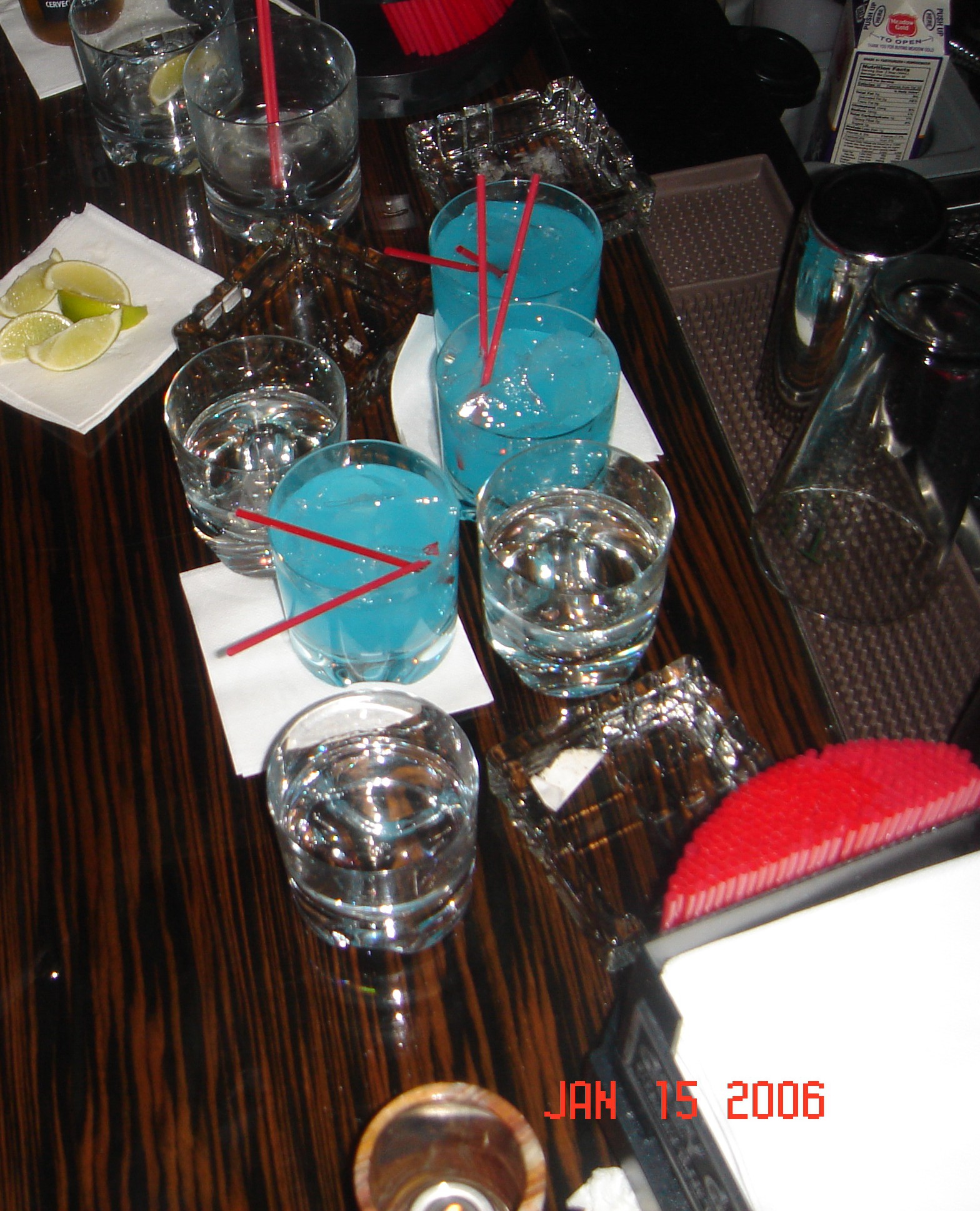a table with glasses and drinks