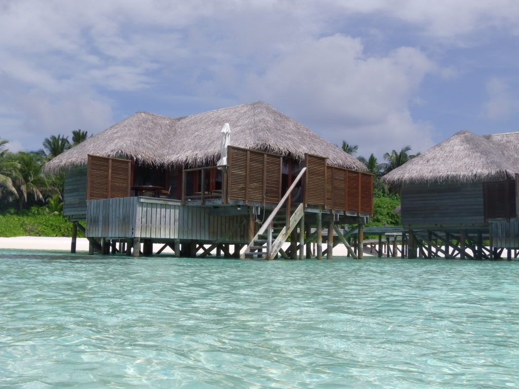 a hut on stilts in water