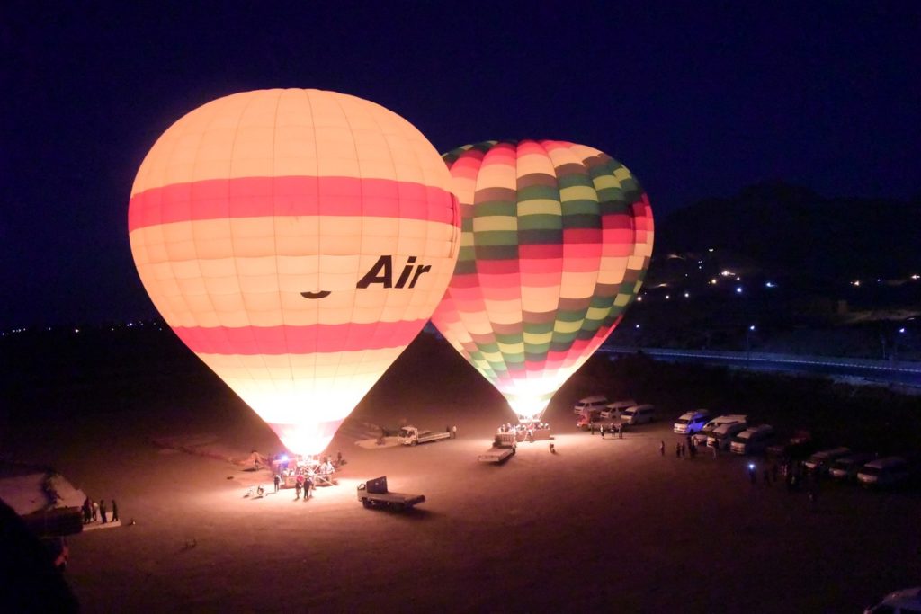 hot air balloons in the night sky