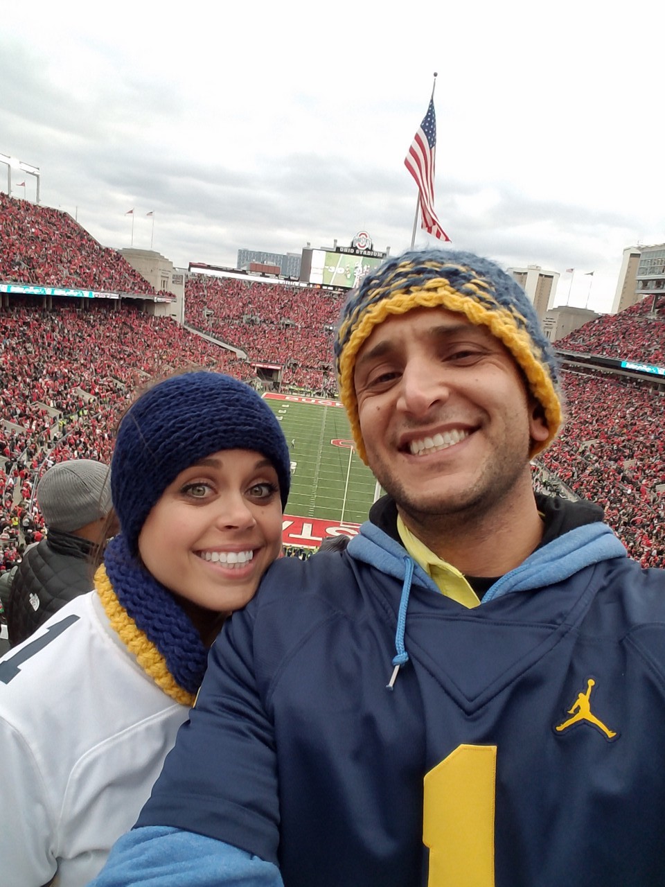 What do you do in a city where everyone hates you? Do you cower and not wear your alma mater's colors? Do you say, "May the best team win?" Or do you go full monty and floss your Michigan gear from head to toe?