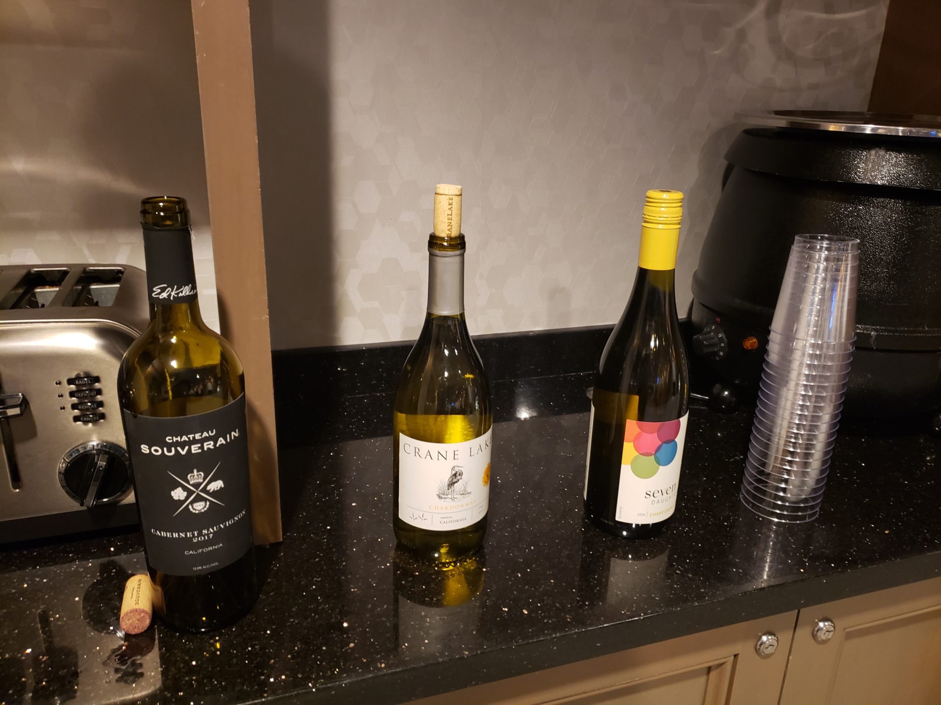 a group of wine bottles on a counter