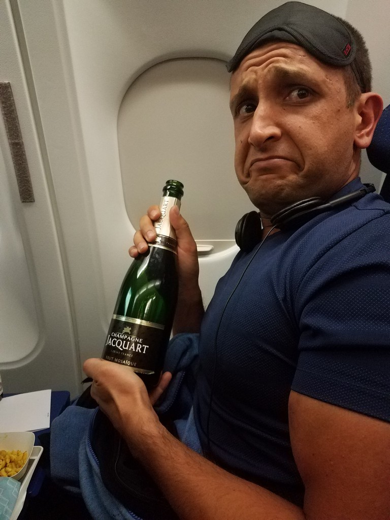 a man holding a bottle of champagne