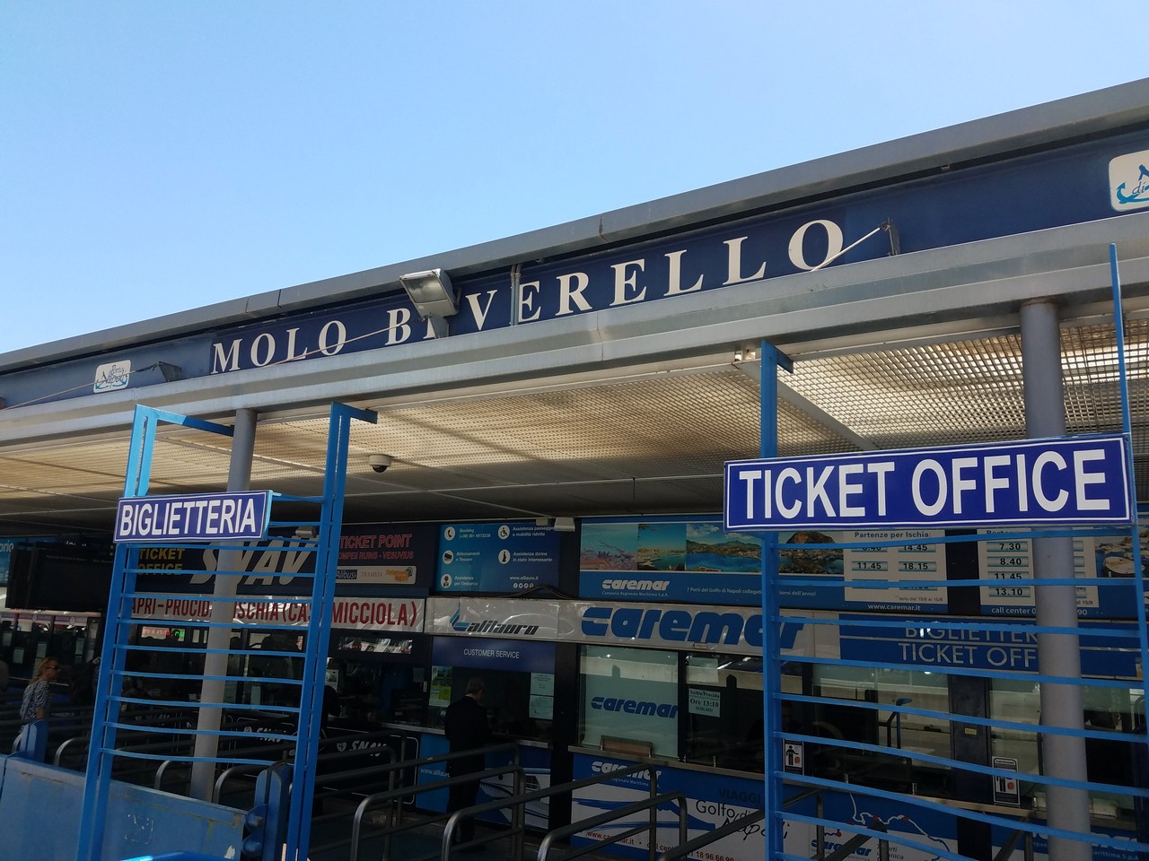 a ticket office with blue signs