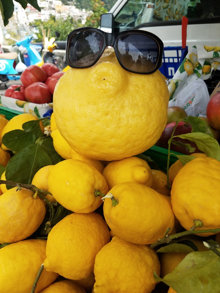 a lemon with sunglasses on top of it