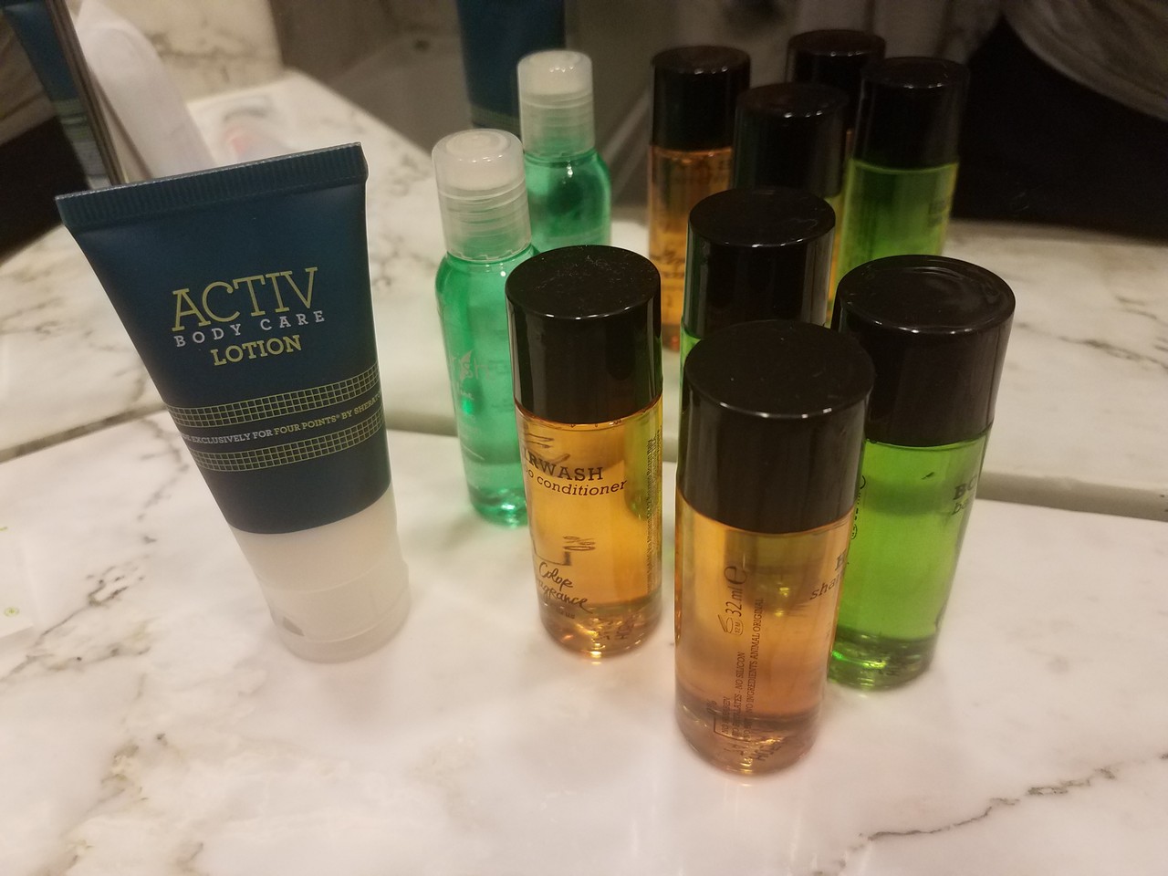 a group of small bottles of body care