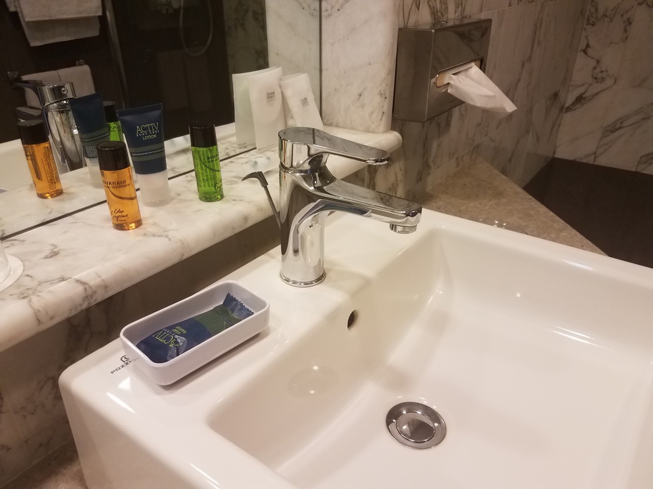 a bathroom sink with a soap dish and a soap dish