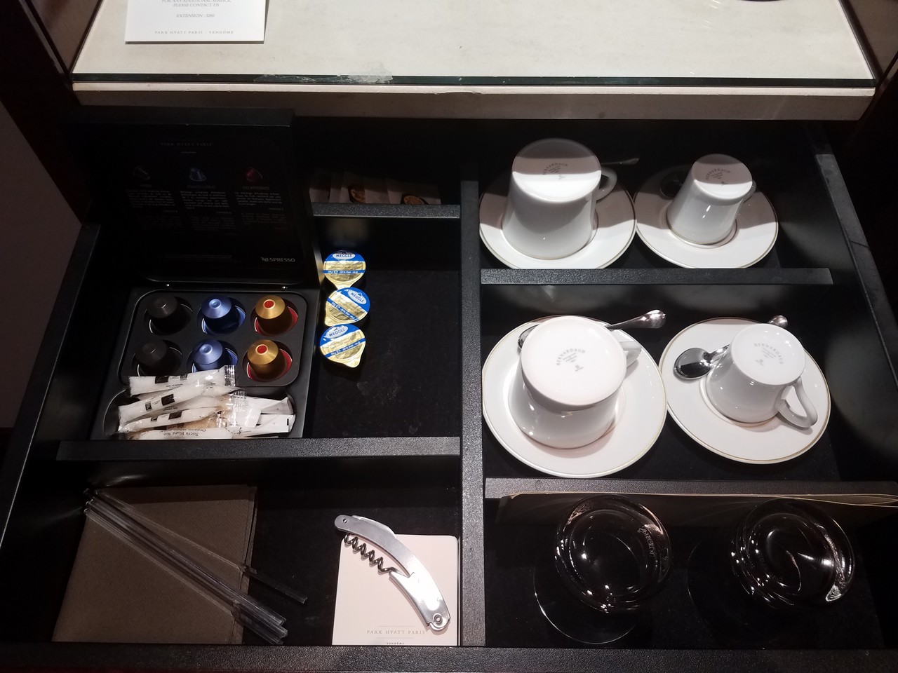 a tray with tea cups and saucers