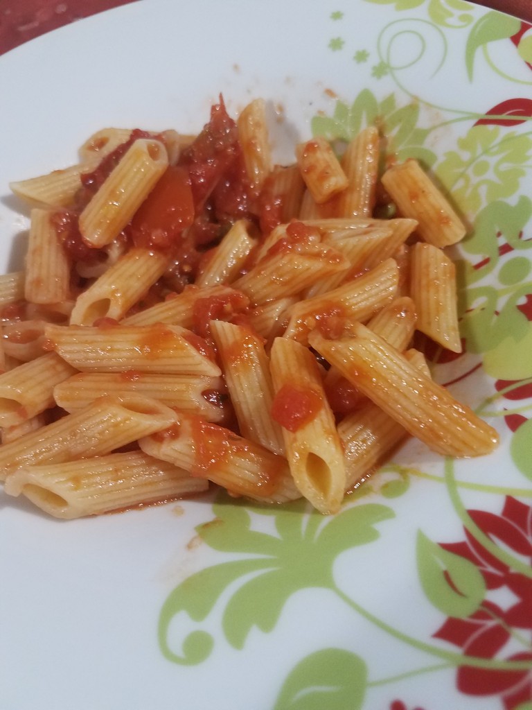 a plate of pasta with sauce