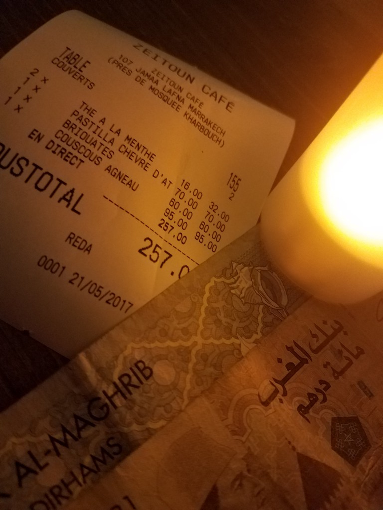 a paper bill and a candle
