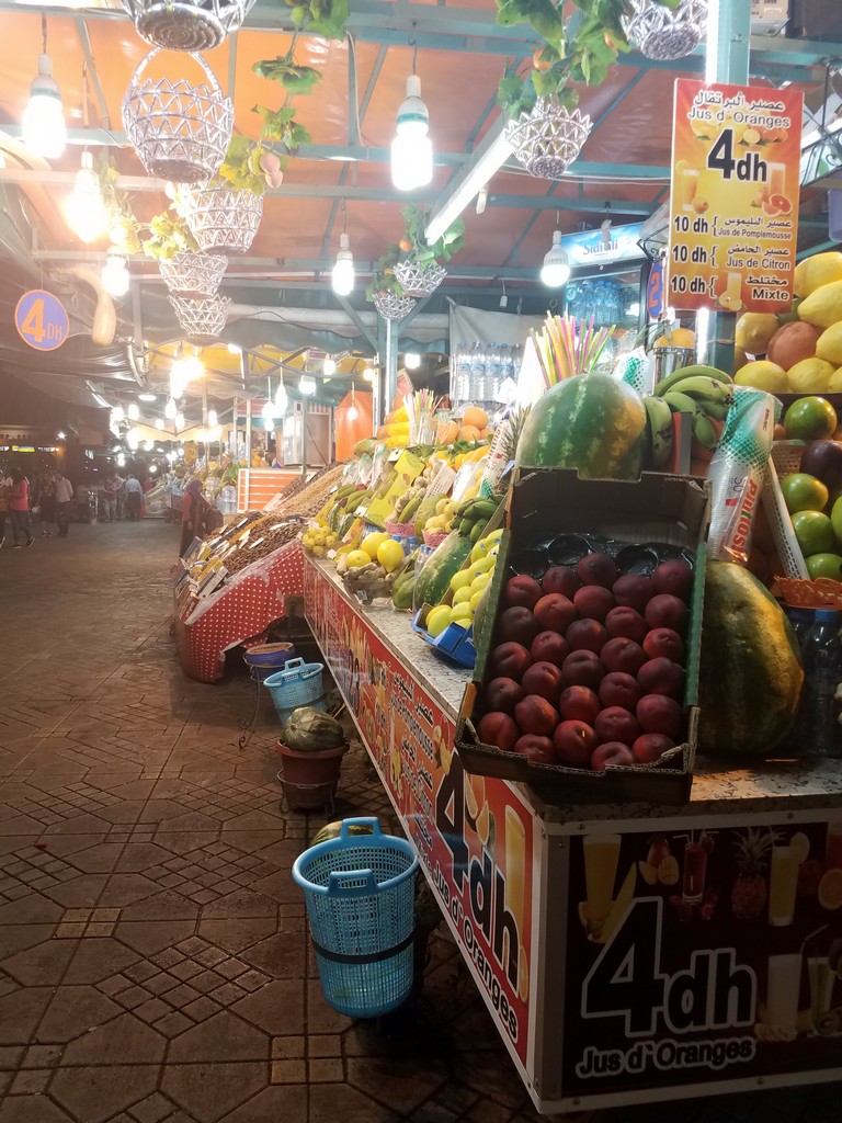 a fruit stand with many different fruits