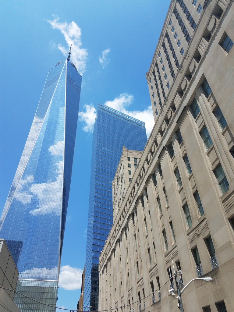 a tall buildings with a blue sky
