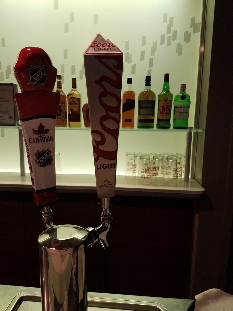 a beer tap with a red and white beer tap and a red and white beer tap
