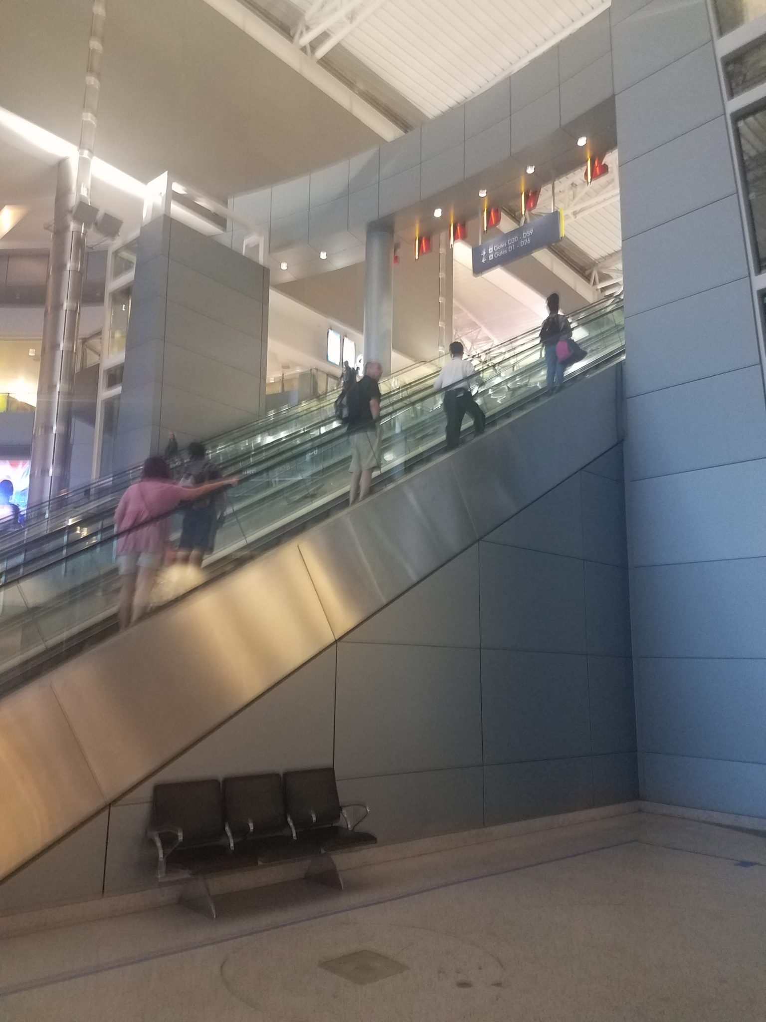 people on an escalator in a building