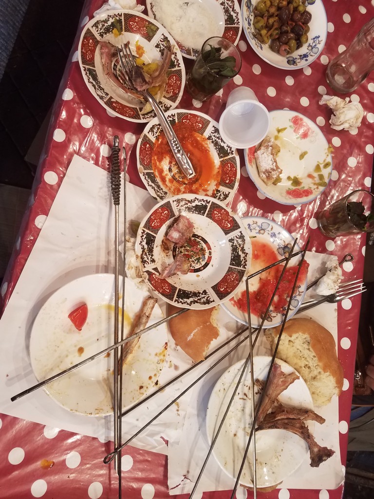 a table with plates and forks on it
