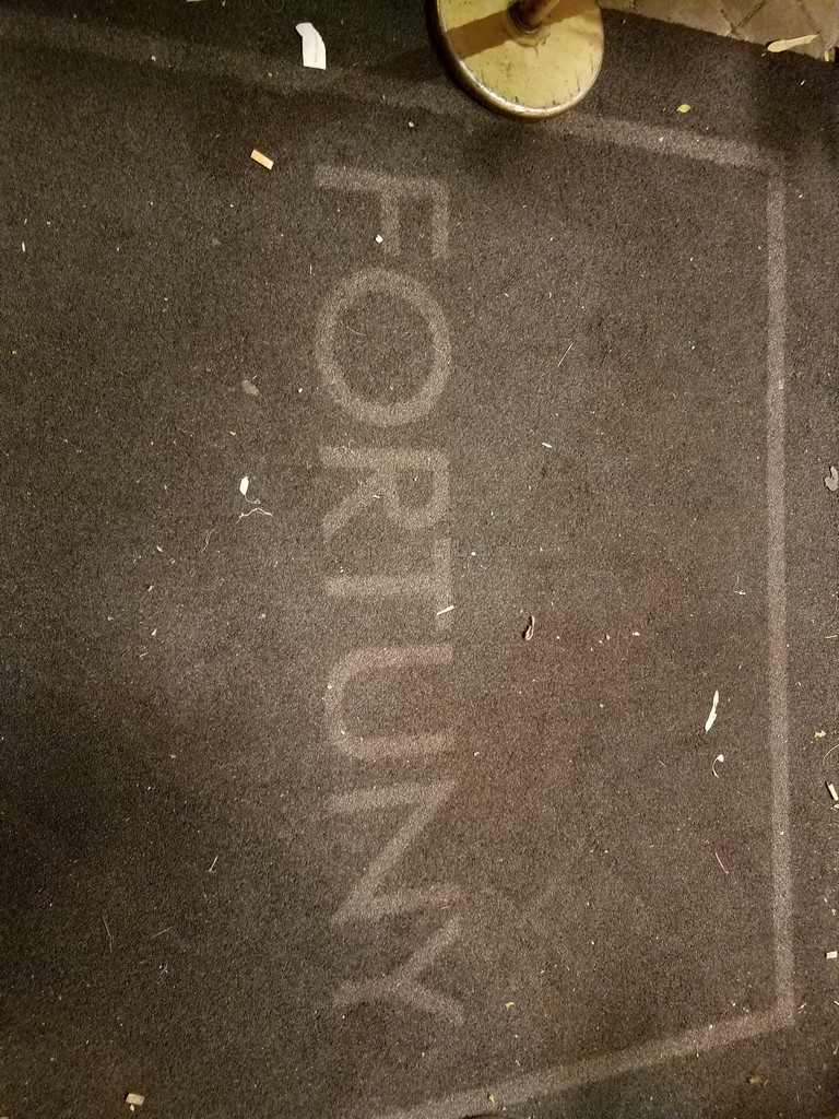 a grey carpet with white text