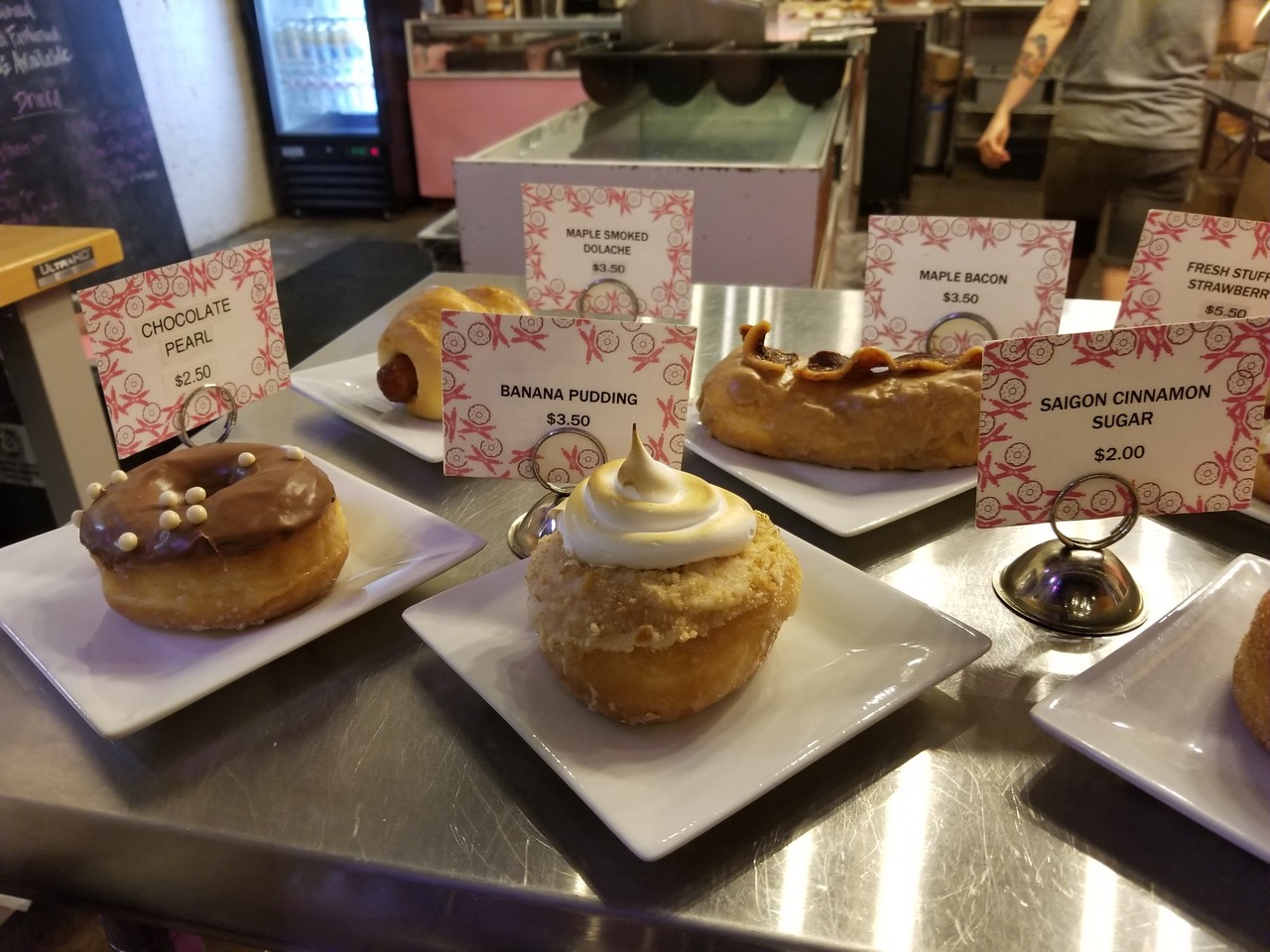a plate of pastries with signs on it