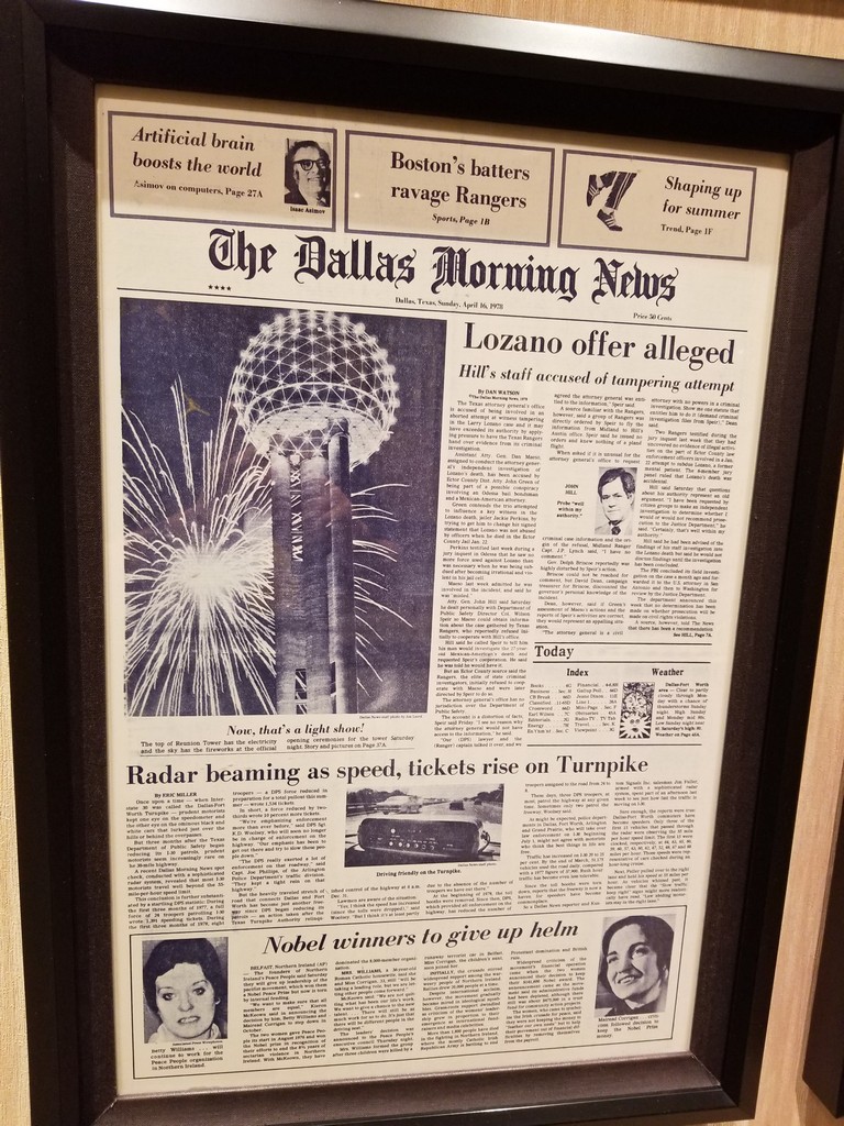 a framed newspaper with fireworks